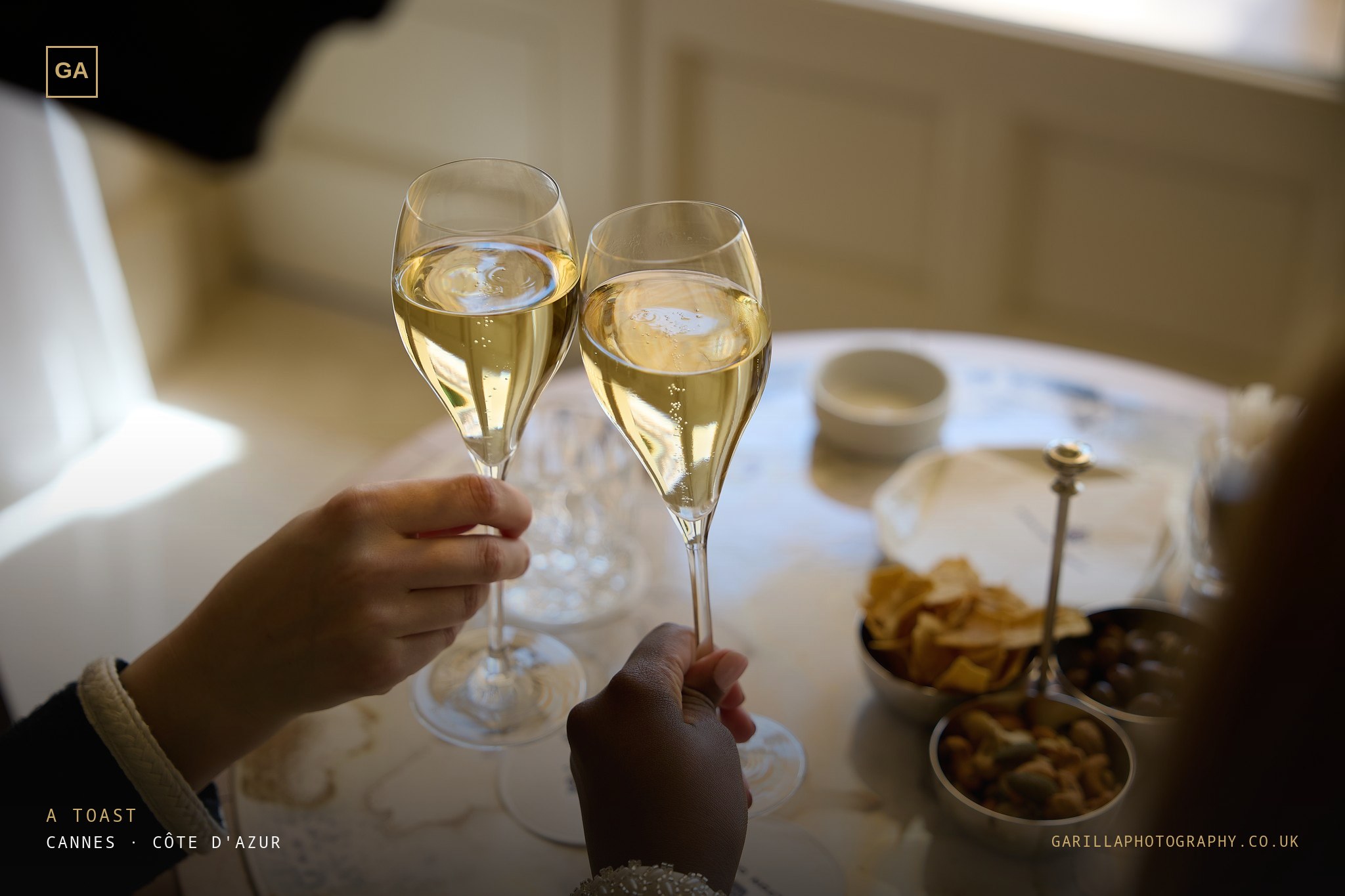Two hands clinking champagne flutes — titled A Toast