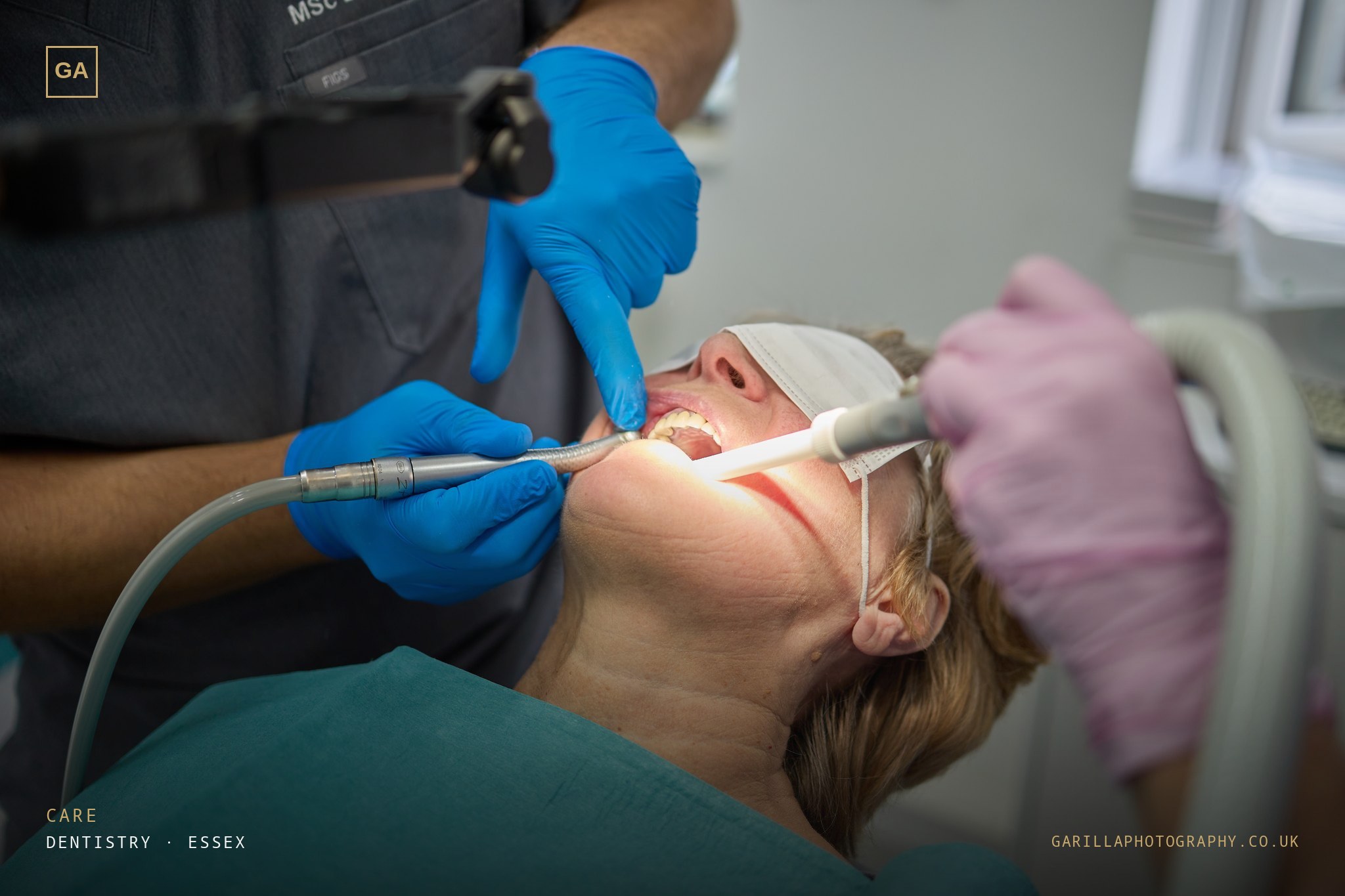 Close view of a patient being treated with gloved hands and suction — titled Care