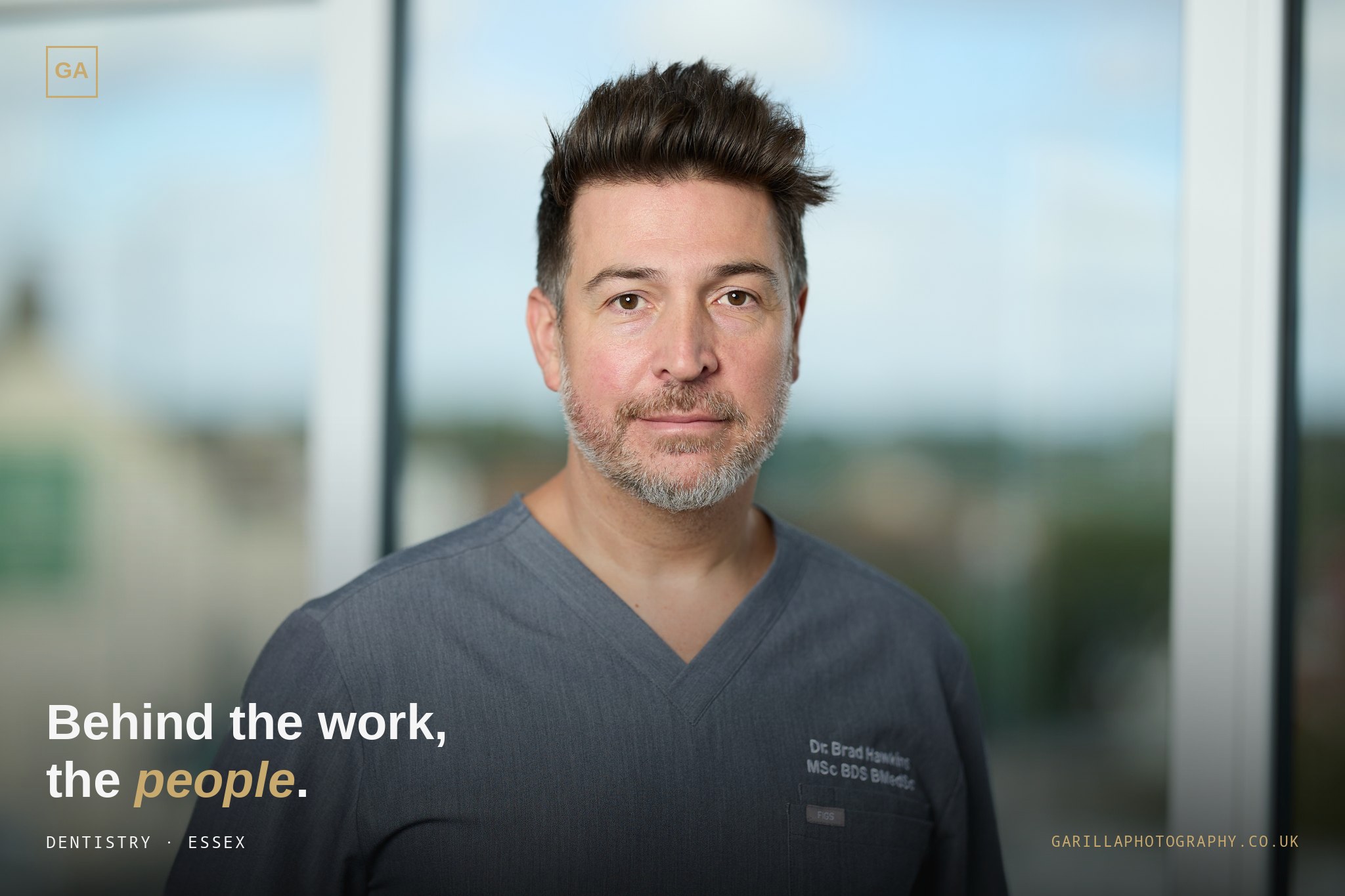 Dr Brad Hawkins in scrubs by the window — the cover frame, captioned 'Behind the work, the people.'