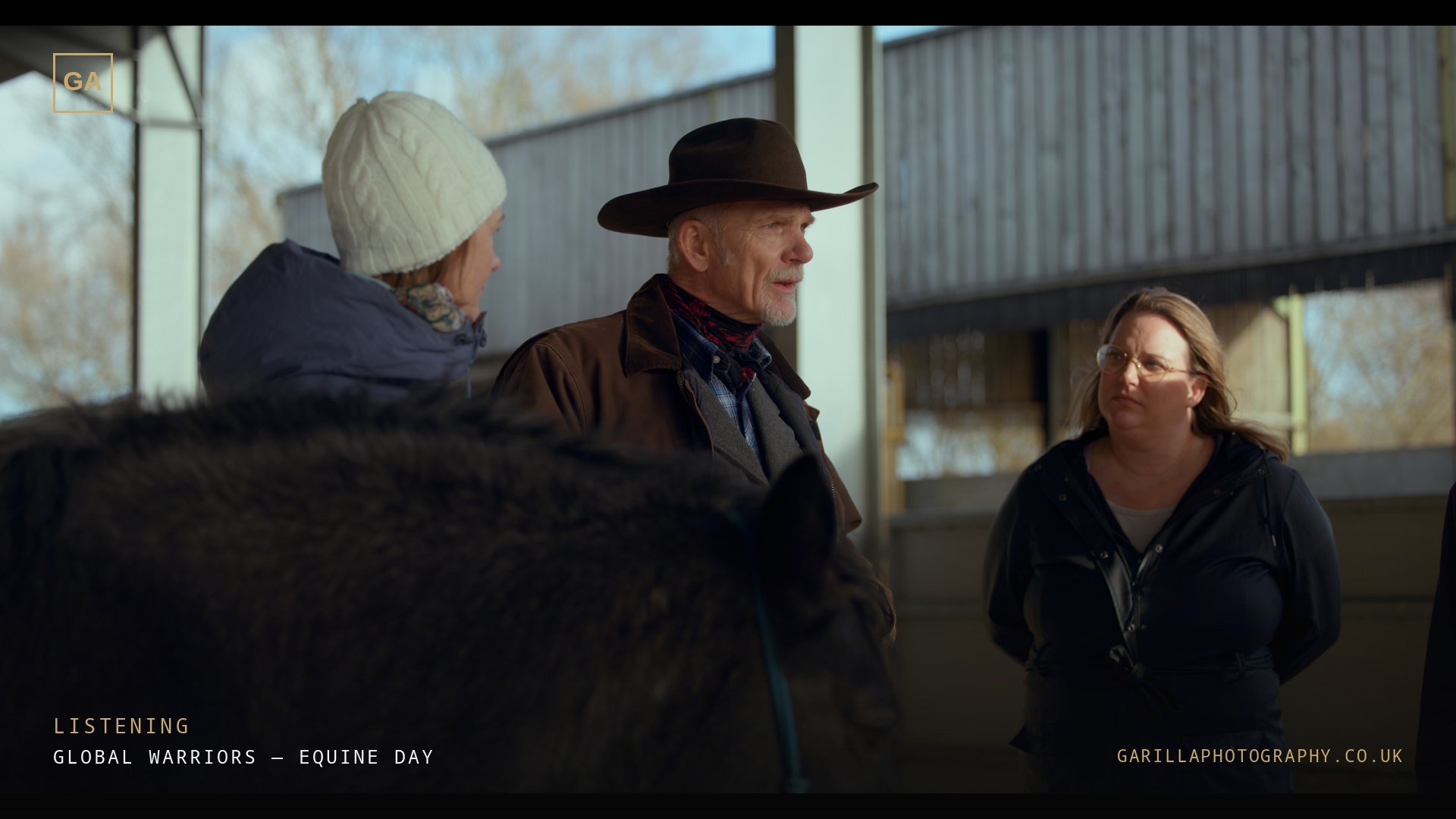 Participants listening to the handler in the arena — a still from the film, titled Listening