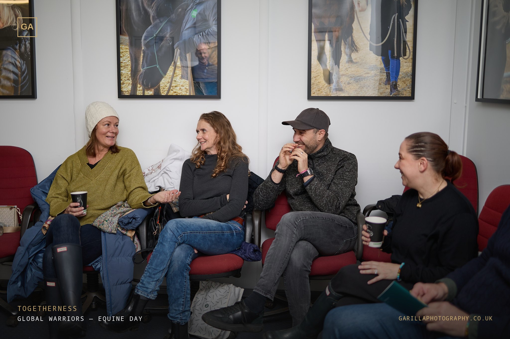 Four of the team laughing together over coffee — titled Togetherness
