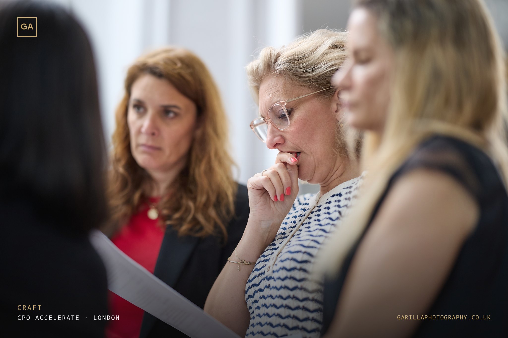 Two delegates in focused discussion — titled Craft