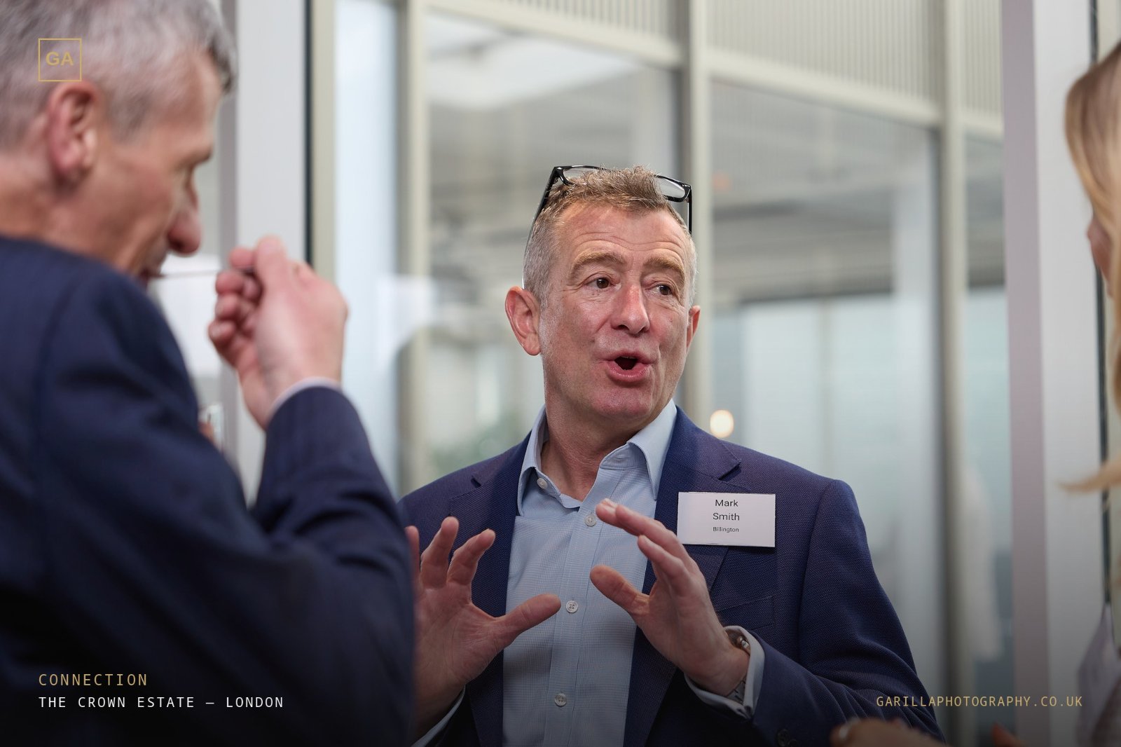 Two guests in animated conversation at the networking session
