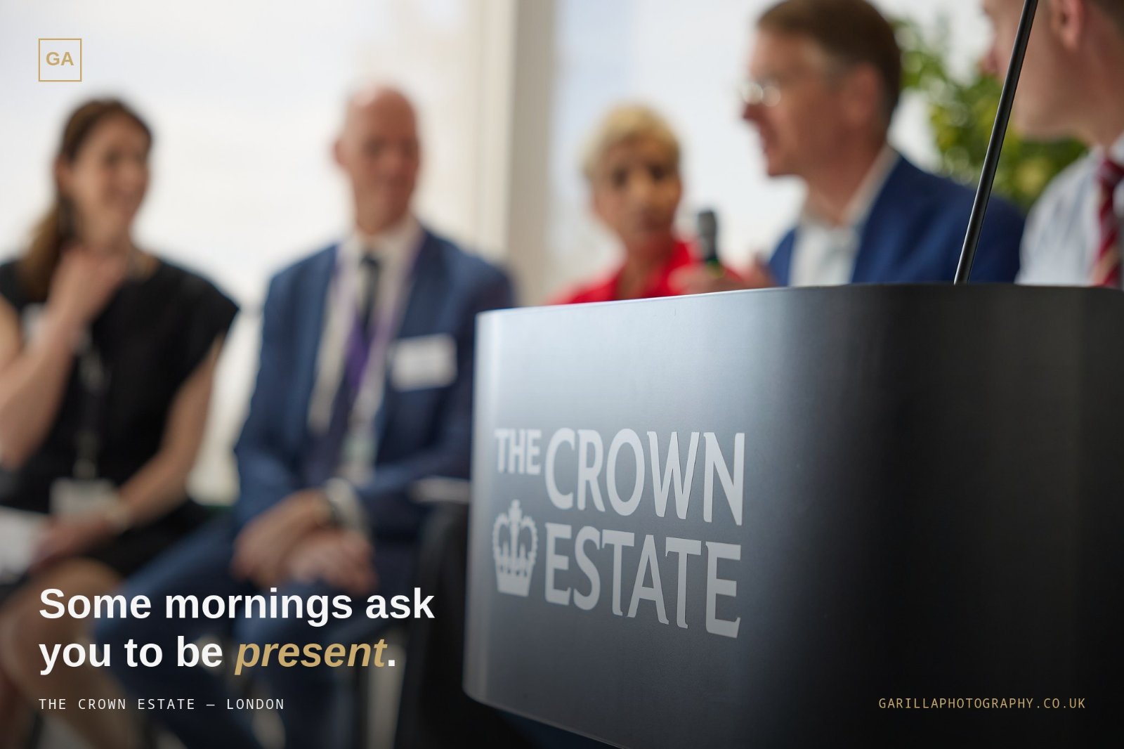 The Crown Estate lectern in focus with panellists softly blurred beyond — captioned 'Some mornings ask you to be present.'