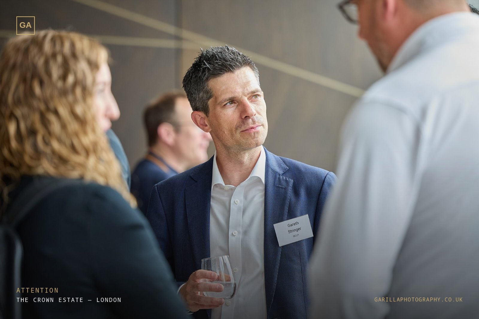 A delegate listening intently during the networking session