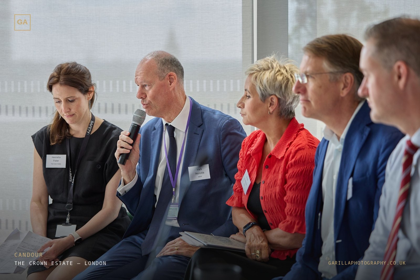 A panellist speaking candidly into the microphone