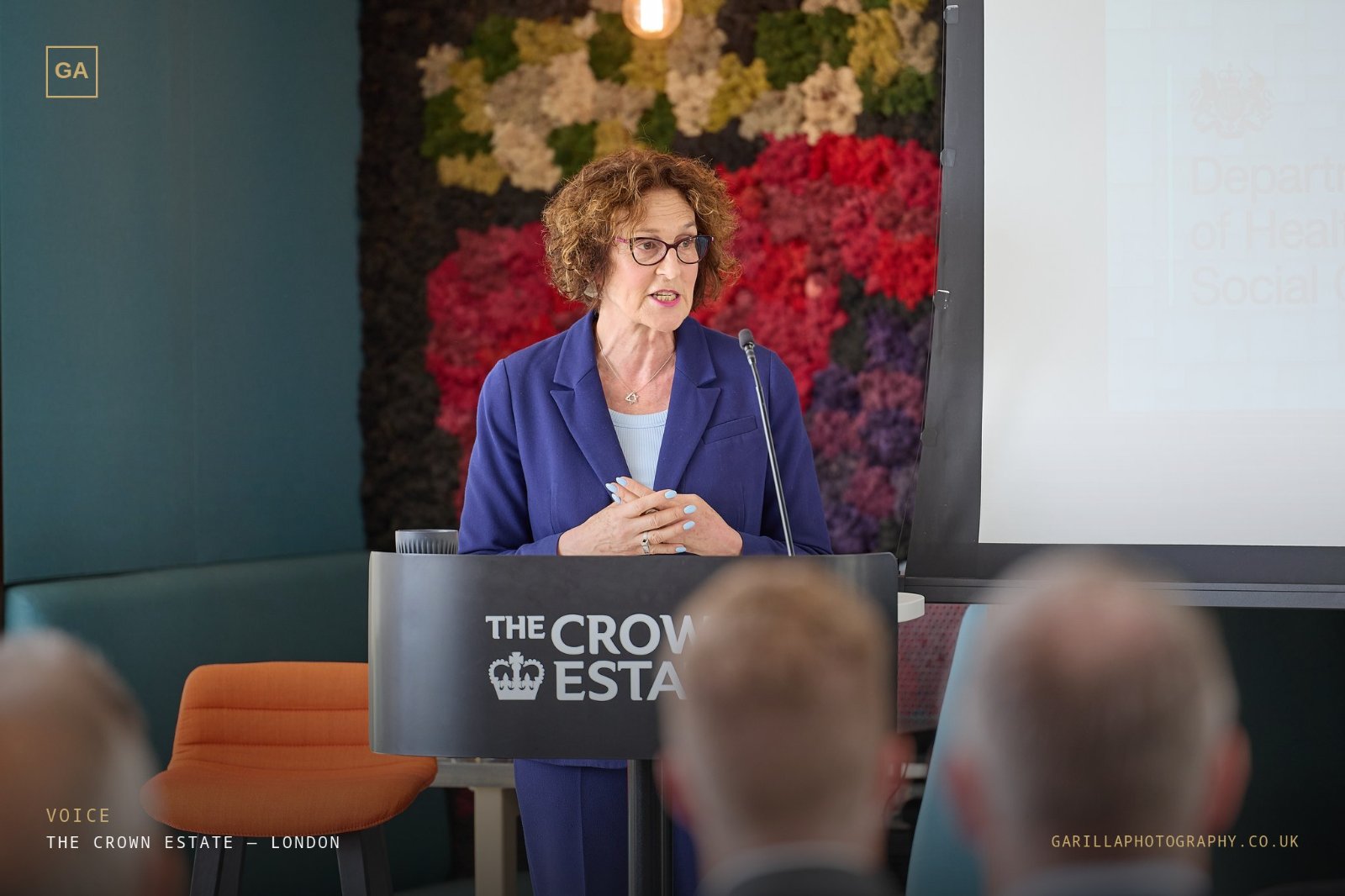 A speaker at The Crown Estate lectern addressing the room