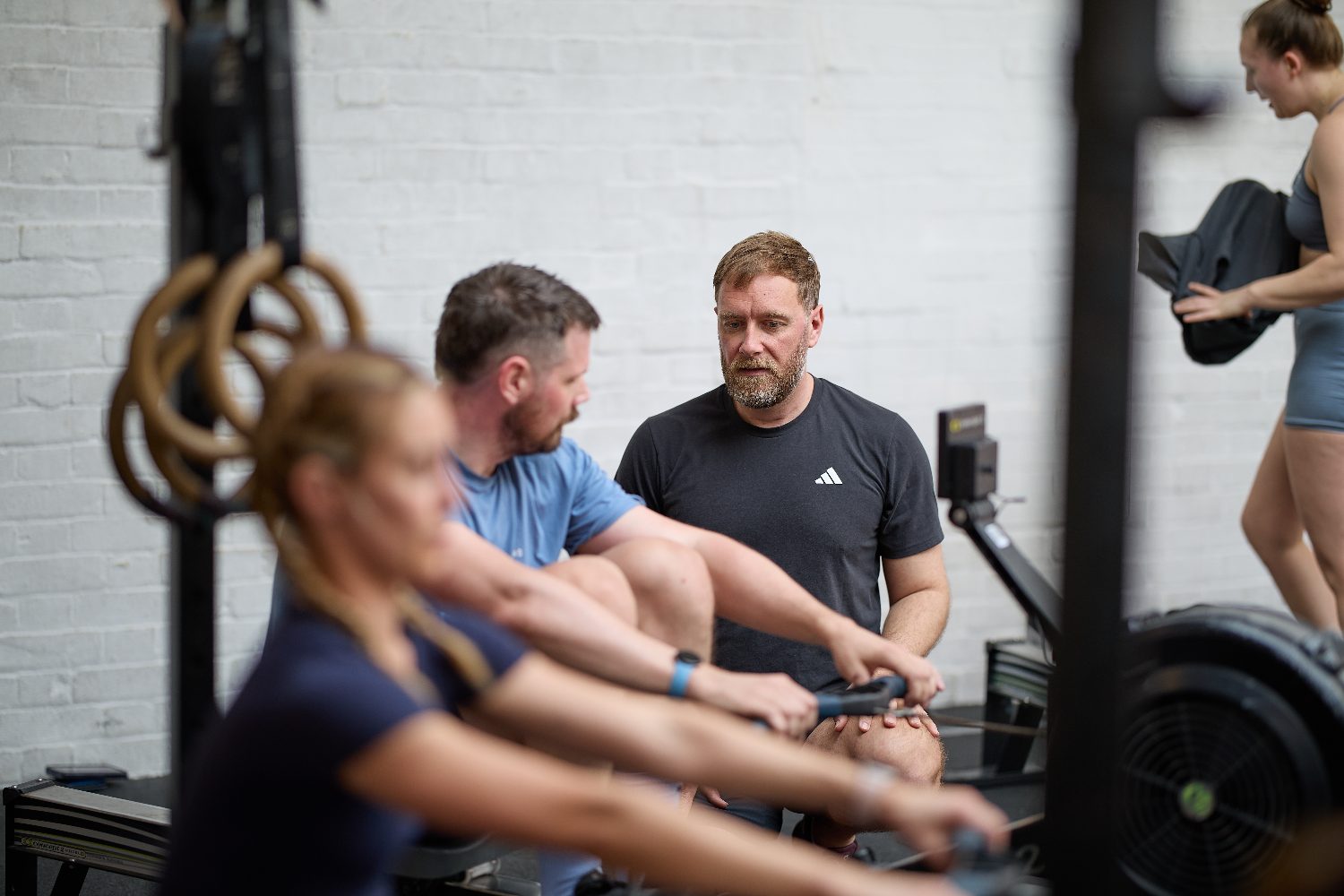 Rob Mayes watching an athlete's rowing technique