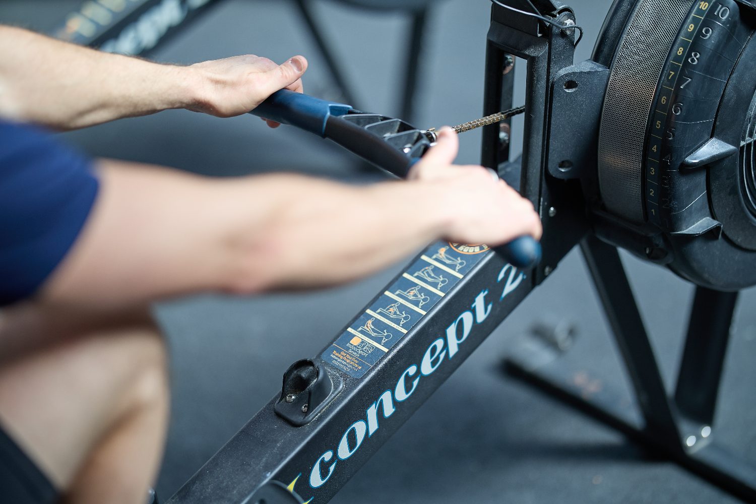 Detail of hands on a Concept2 rower handle
